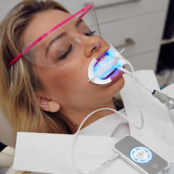 A dental patient receiving an in office professional teeth whitening treatment in Poway, CA