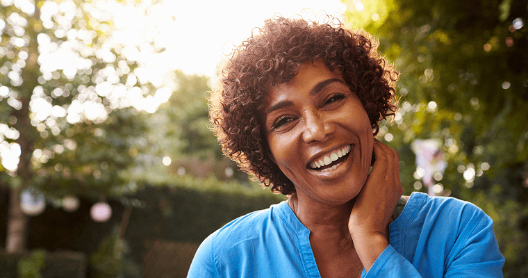 A female smiles after dental treatment at Joe N.T. Nguyen DDS in Poway CA